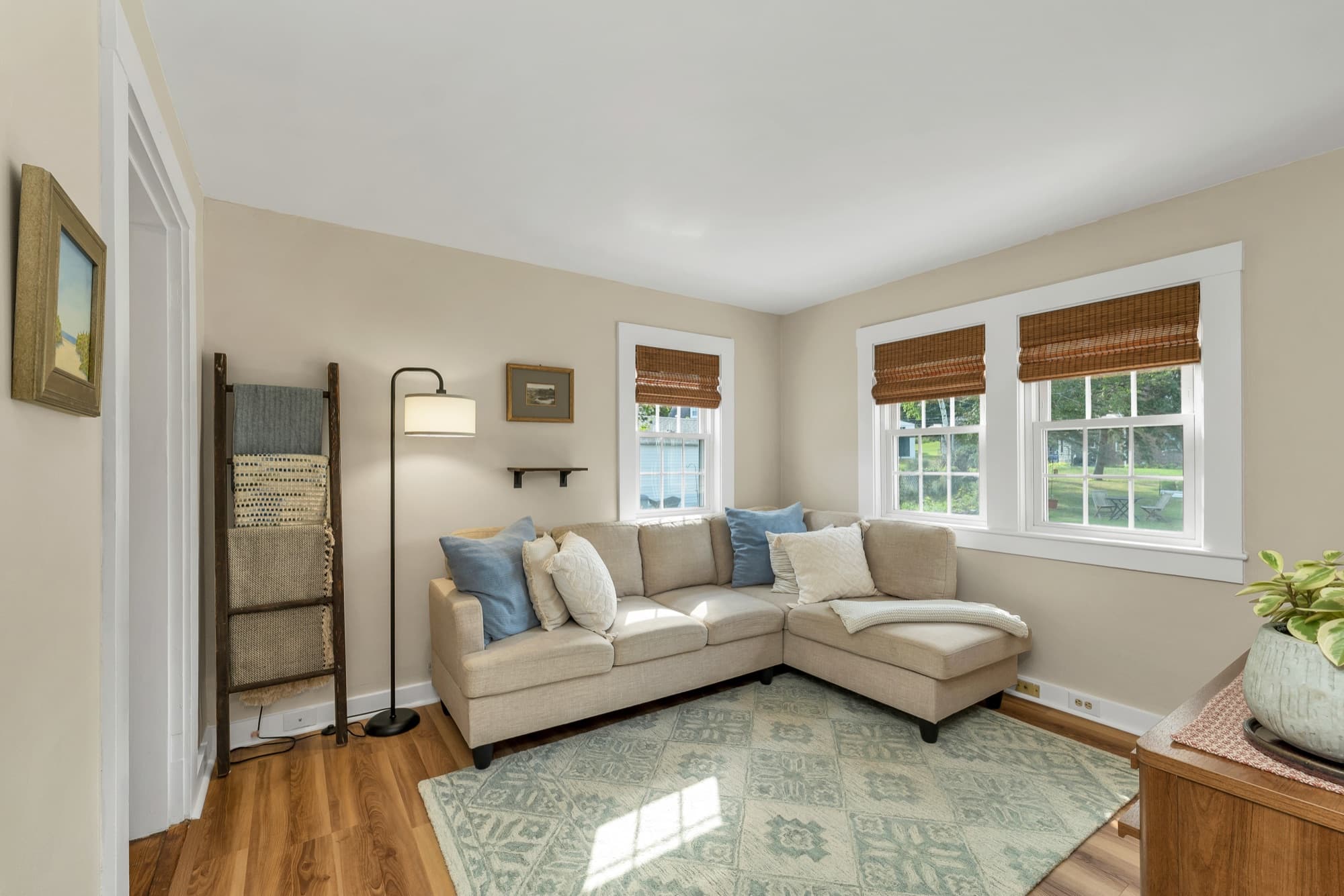 Unit 25 living room from the corner, with double windows